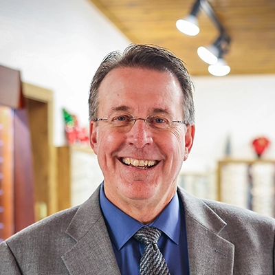 Eye Doctor Gary M. Stremcha Smiling In Suit
