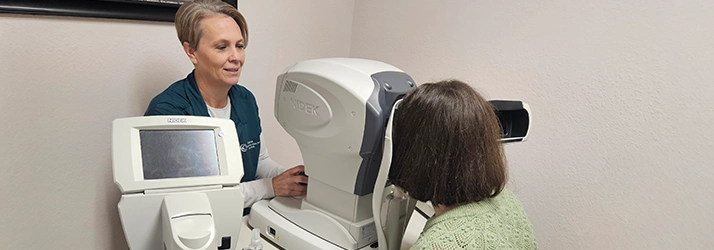 Patient Looking Into Eye Exam Machine