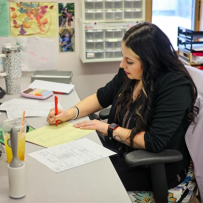 Staff Member Completing Form