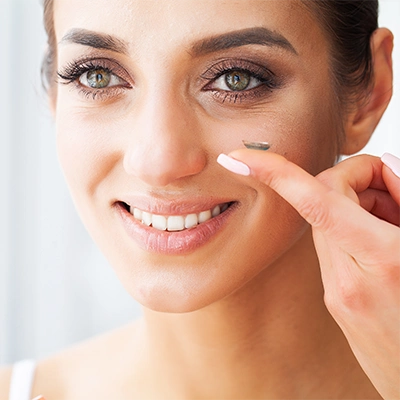 Woman Putting In Contacts